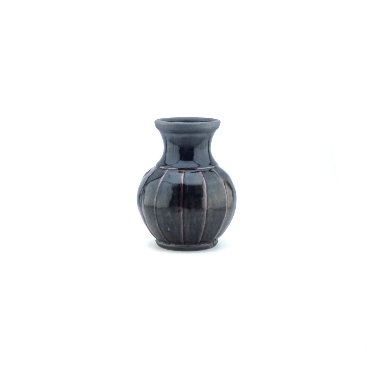 Faceted stoneware bottle vase