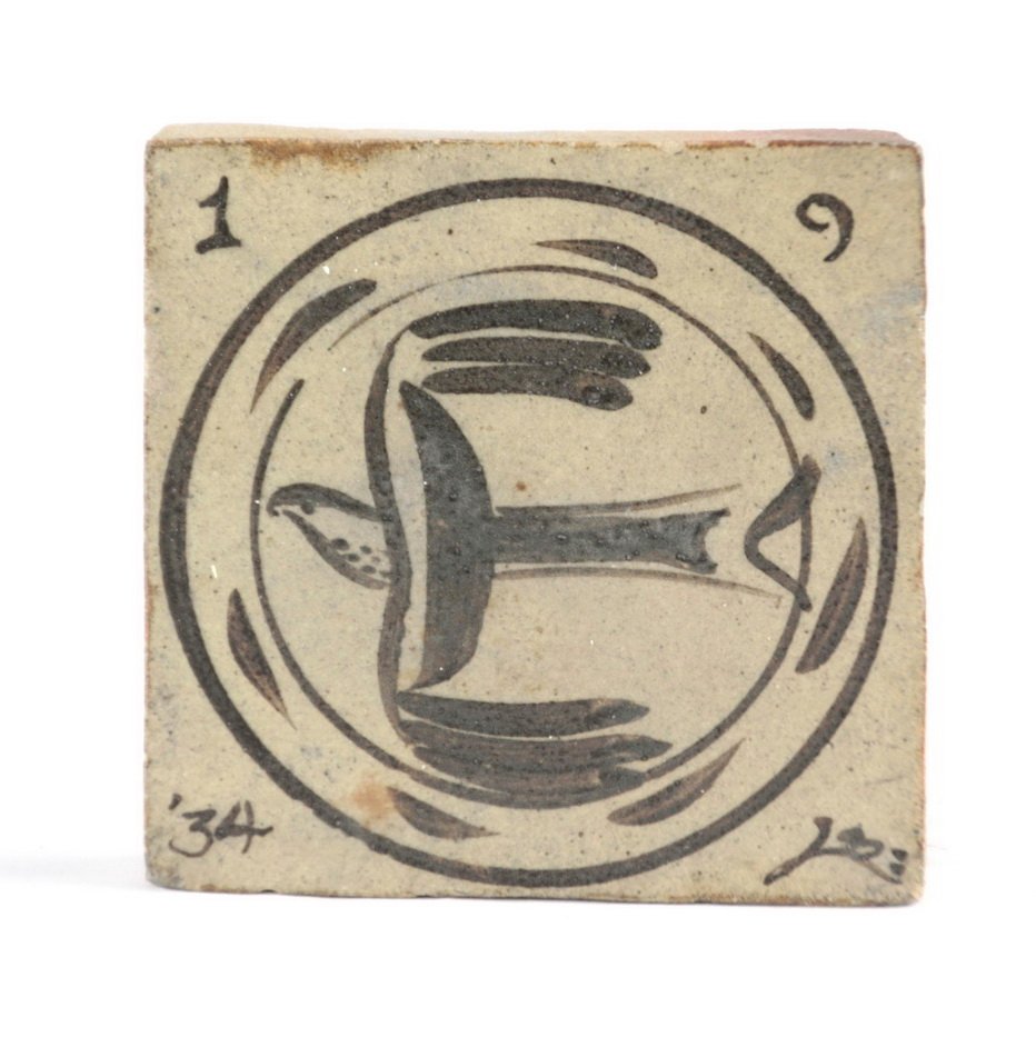 Tile with bird in flight