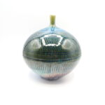 Textured narrow neck vessel